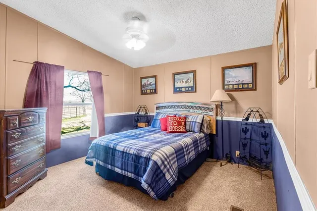 a view of residential houses with snow on the road