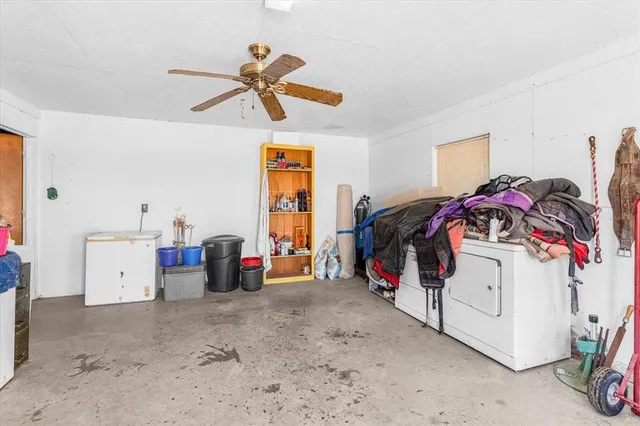 a room with lots of furniture and clutter