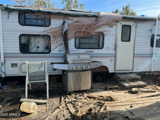 a brick house with a stove and more cabinets