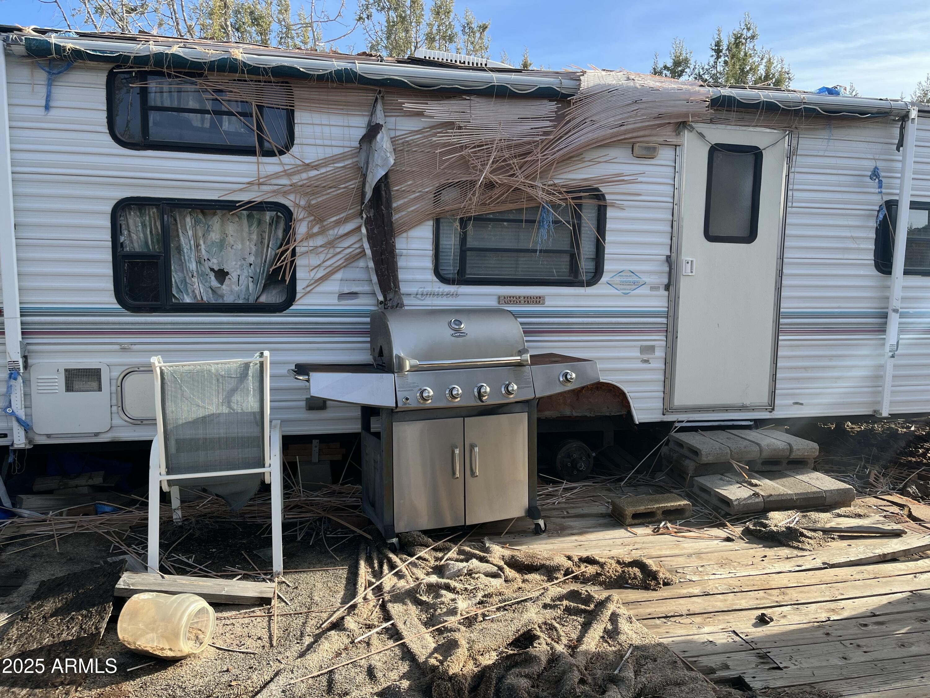 17411 Ranch Road, Unit 62 Williams, AZ 86046 - Photo 6 of 9 a brick house with a stove and more cabinets