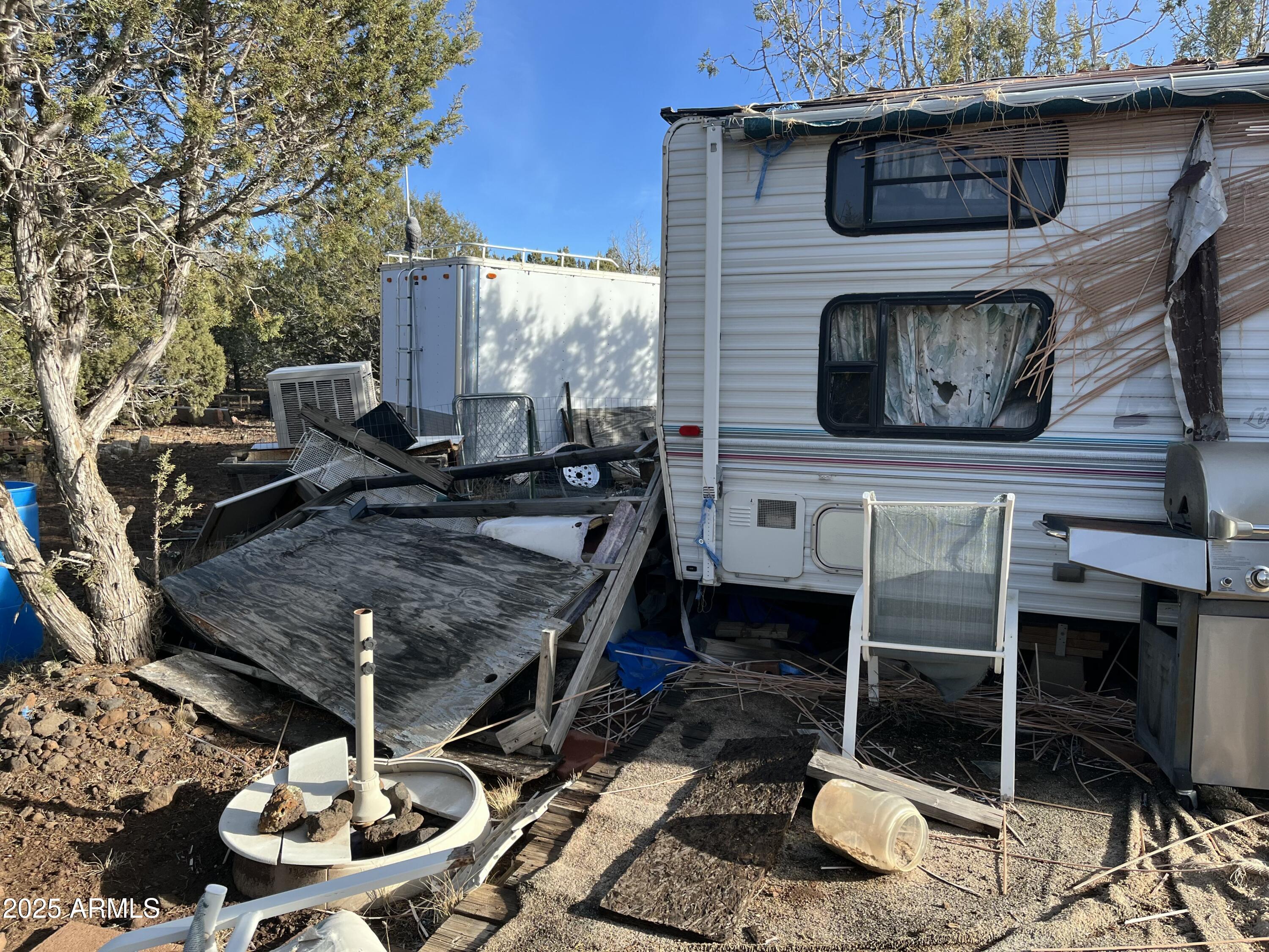 17411 Ranch Road, Unit 62 Williams, AZ 86046 - Photo 7 of 9 a living room with furniture and a fireplace
