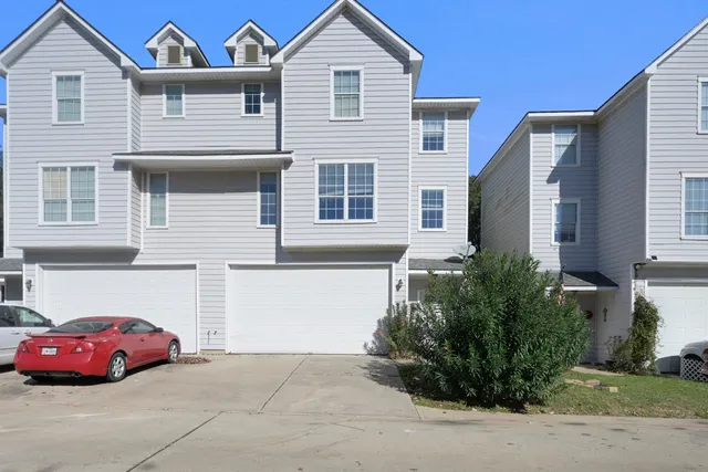a front view of a house with parking