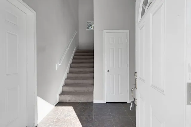 a view of entryway with stairs