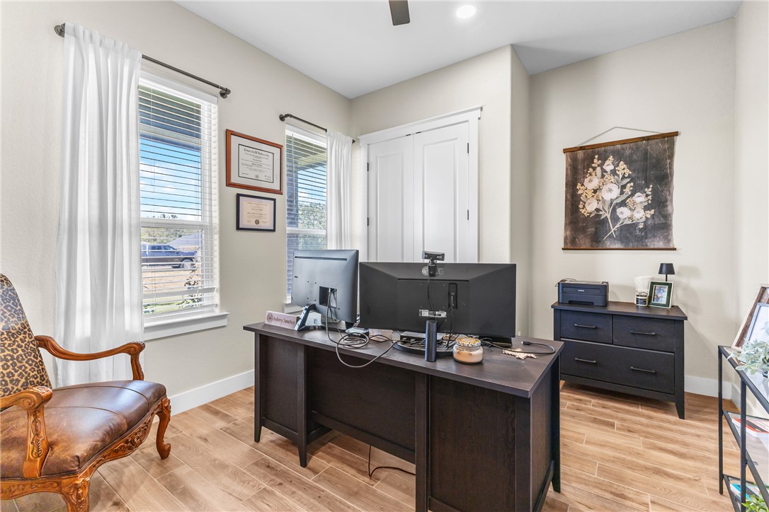 10356 Whiskey River Road Bryan, TX 77808 - Photo 18 of 39 a view of a workspace with furniture and a window