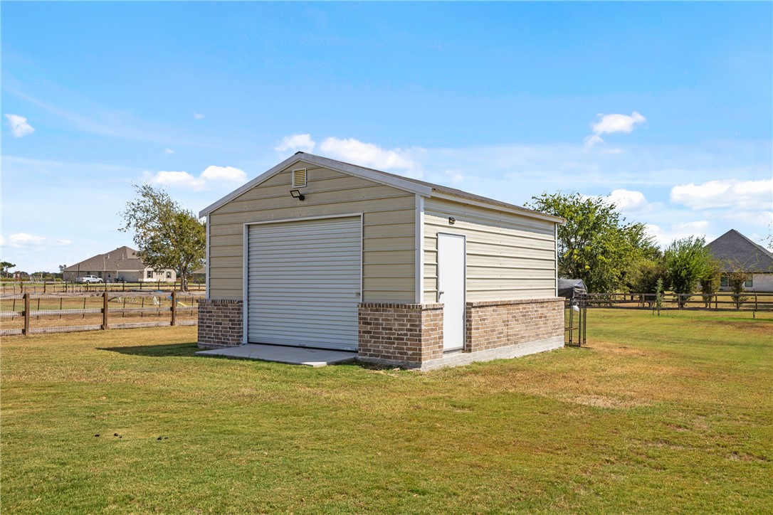 10356 Whiskey River Road Bryan, TX 77808 - Photo 5 of 39 a front view of a house with a yard
