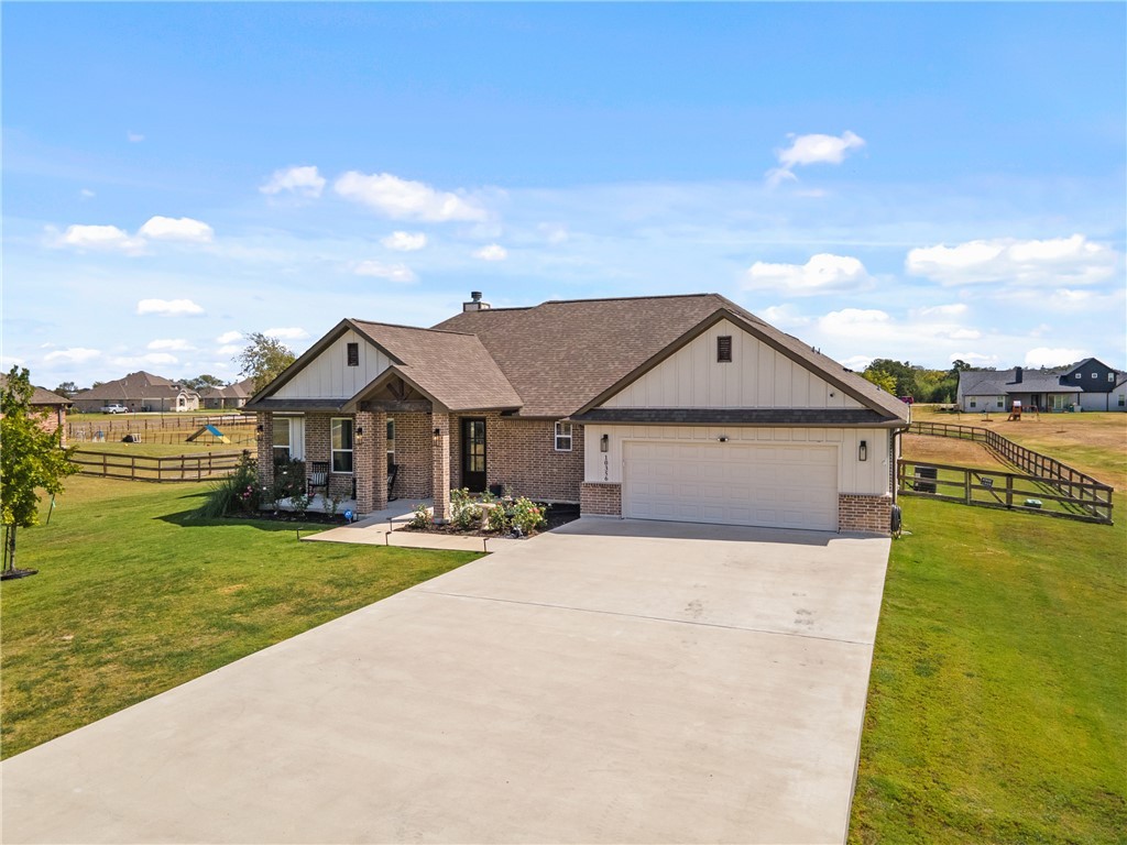 10356 Whiskey River Road Bryan, TX 77808 - Photo 8 of 39 a front view of a house with yard lake and ocean view