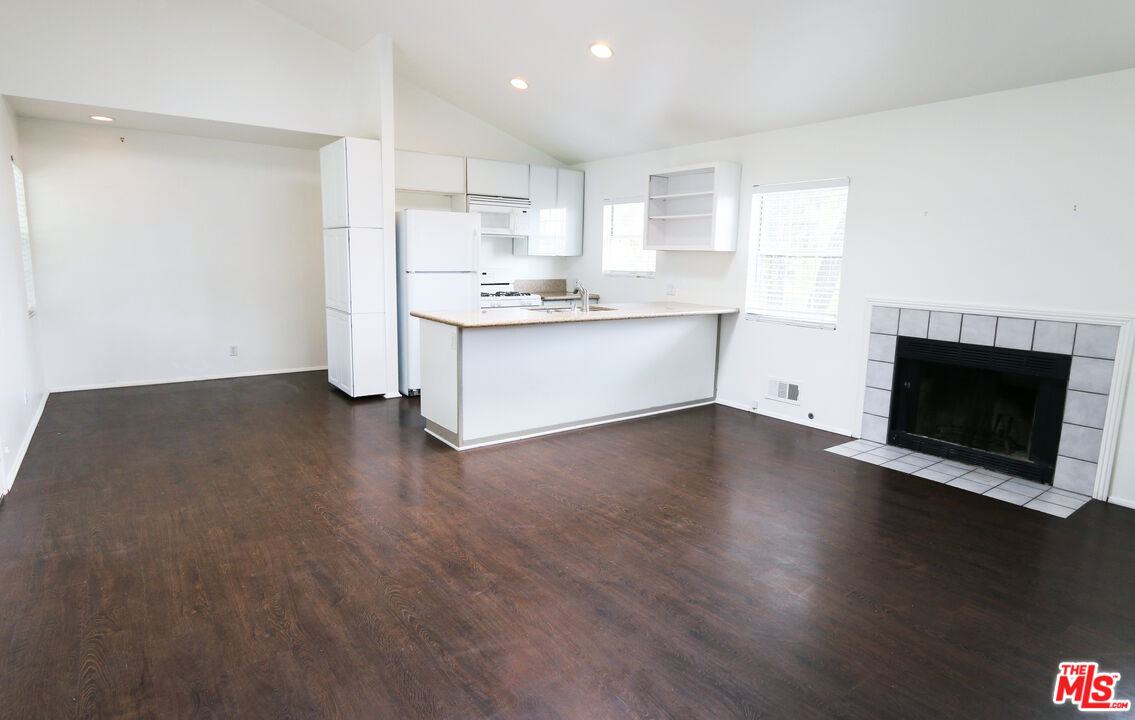 6557 Wandermere Road, Unit GH Malibu, CA 90265 - Photo 12 of 17 a view of kitchen with wooden floor and electronic appliances