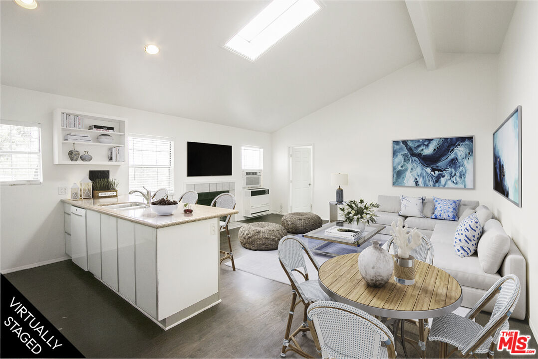 6557 Wandermere Road, Unit GH Malibu, CA 90265 - Photo 9 of 17 a living room with furniture and a flat screen tv