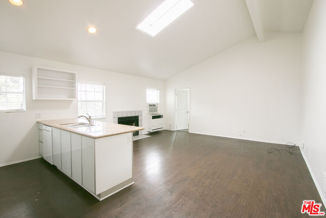 6557 Wandermere Road, Unit GH Malibu, CA 90265 - Photo 10 of 17 an empty room with a sink and chandelier
