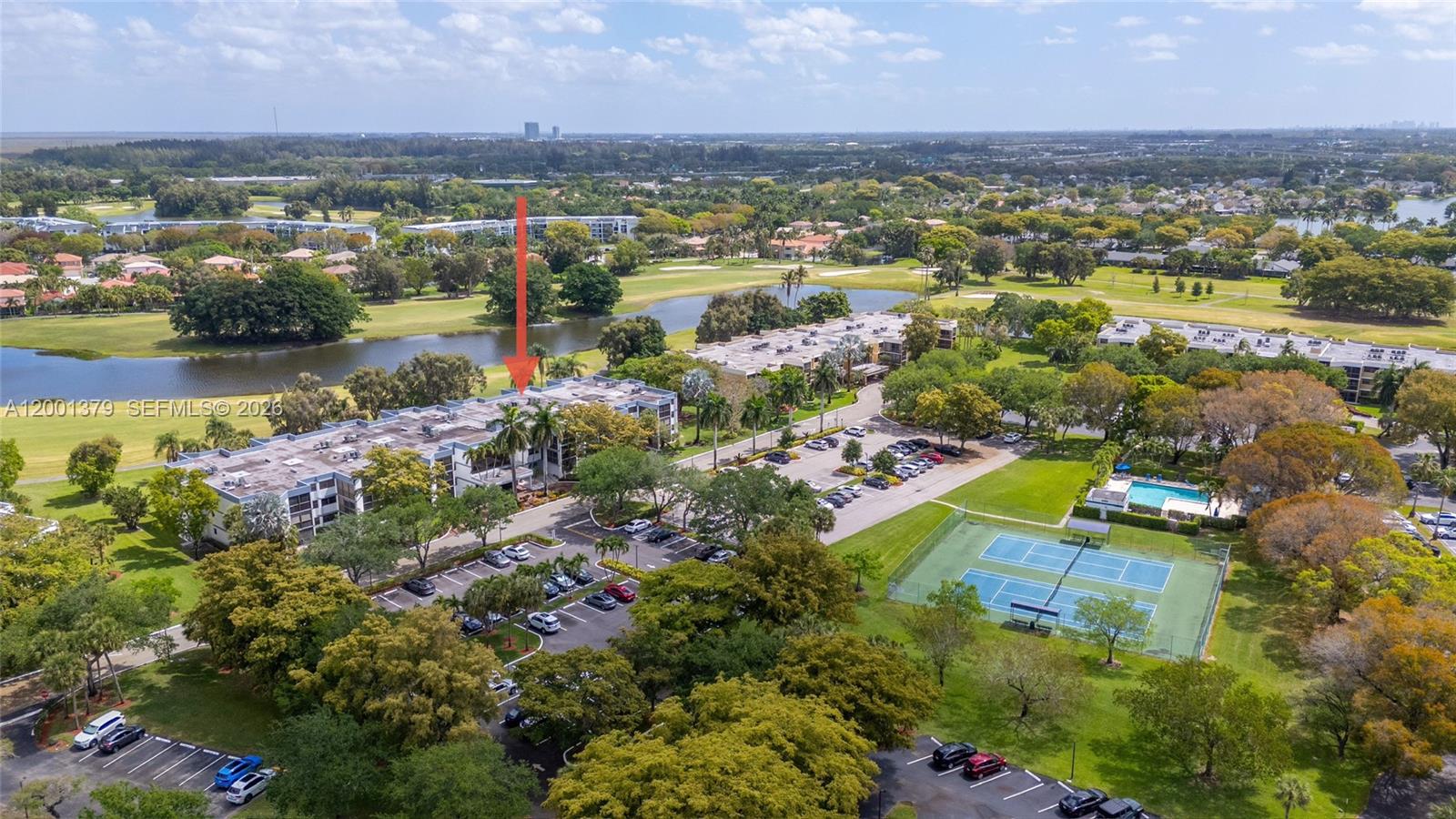 16251 Golf Club Road, Unit 311 Weston, FL 33326 - Photo 6 of 38 an aerial view of residential houses with outdoor space and lake view in back