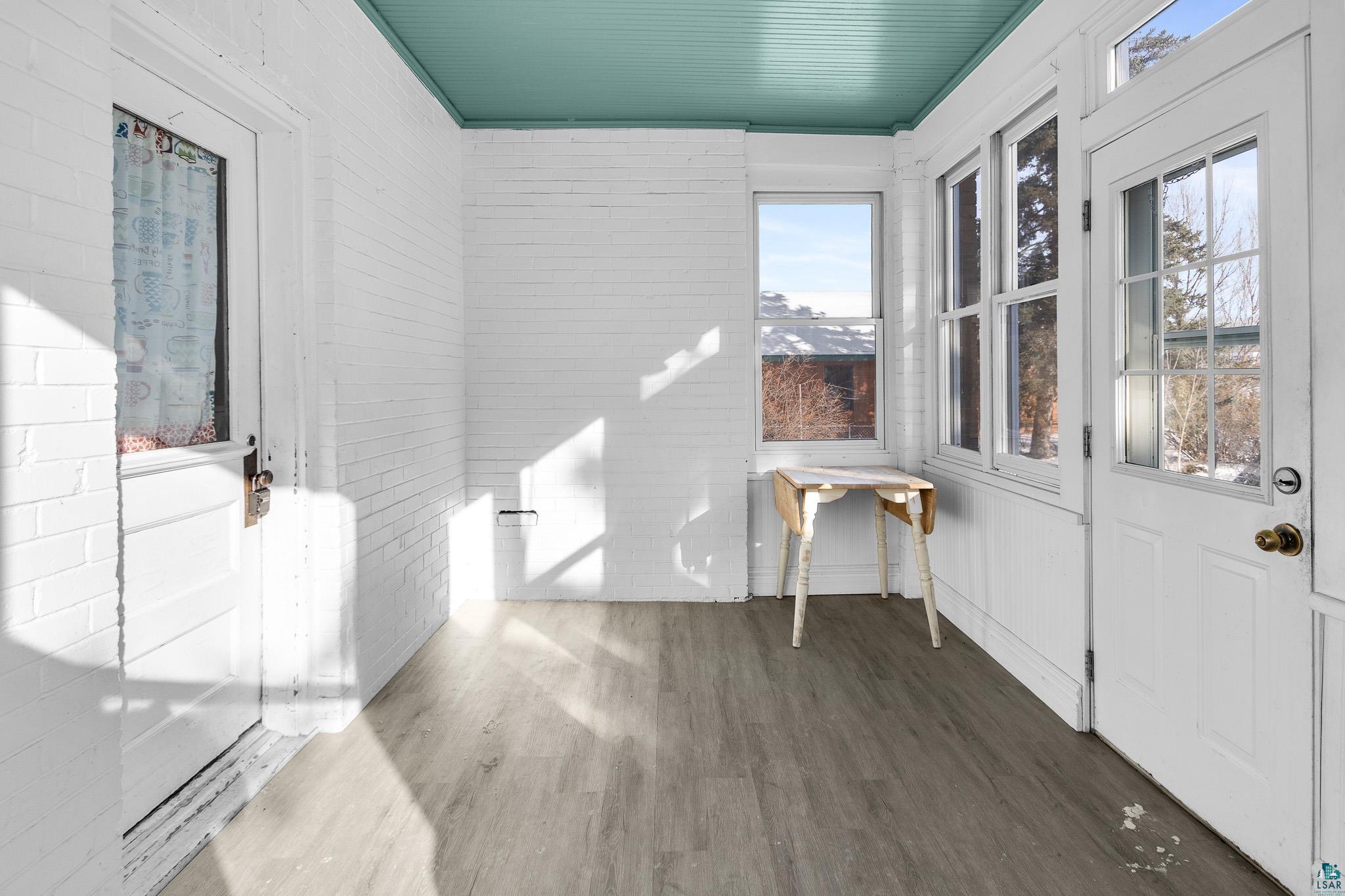 6494 School Street Finlayson, MN 55735 - Photo 23 of 31 Unfurnished sunroom with wood finished floors