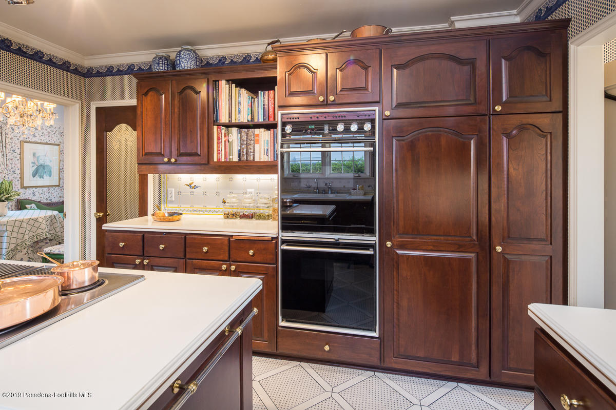 104 Club Road Pasadena, CA 91105 - Photo 22 of 43 a kitchen with stainless steel appliances granite countertop a refrigerator and a stove top oven