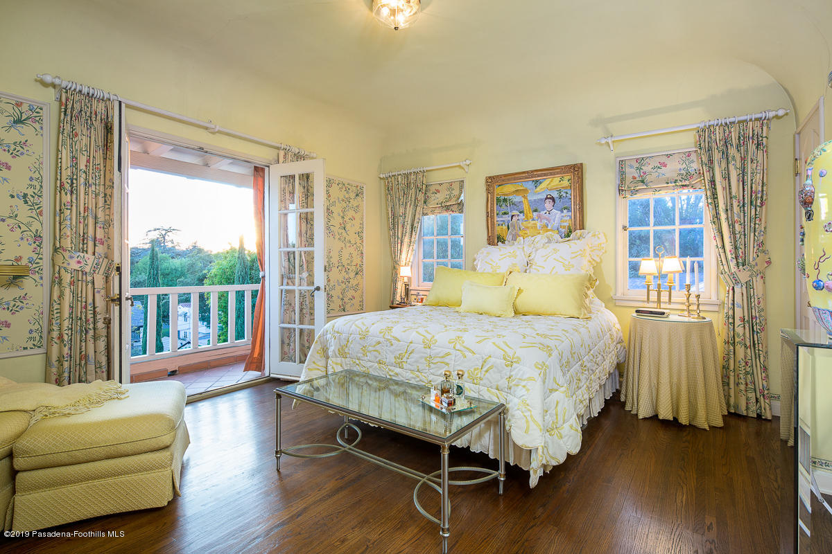 104 Club Road Pasadena, CA 91105 - Photo 28 of 43 a bedroom with a bed couch and a large window