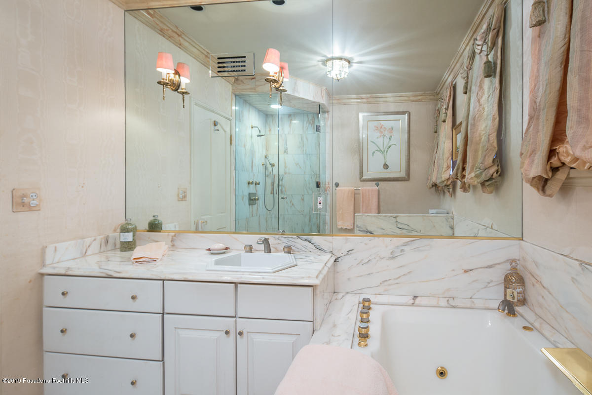 104 Club Road Pasadena, CA 91105 - Photo 35 of 43 a bathroom with a tub sink and mirror
