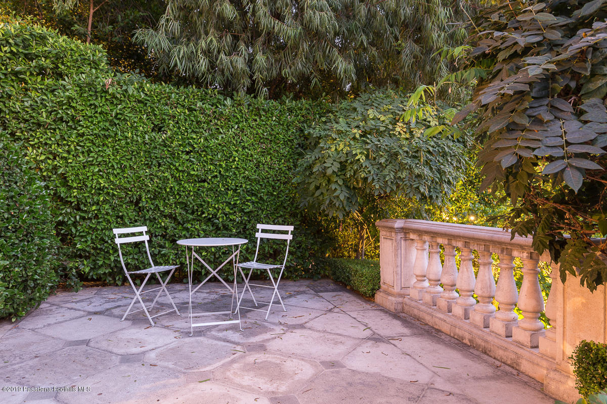 104 Club Road Pasadena, CA 91105 - Photo 40 of 43 a view of a chairs and table in a backyard