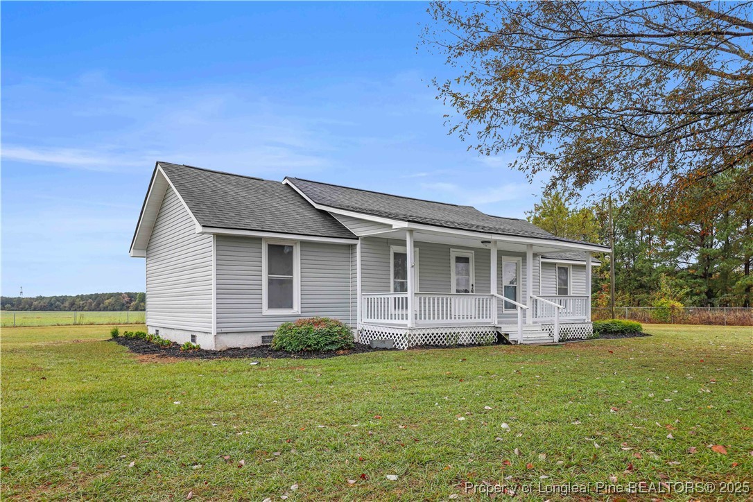 2302 Odom Road Hope Mills, NC 28348 - Photo 24 of 33 a view of a house with a backyard