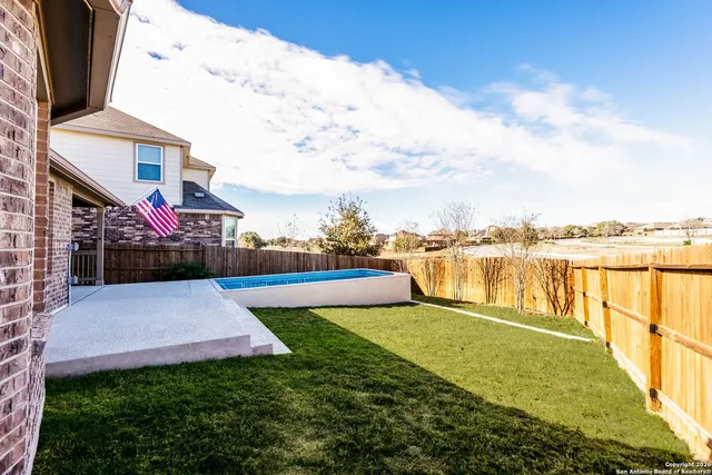 a view of swimming pool with an outdoor space and seating area