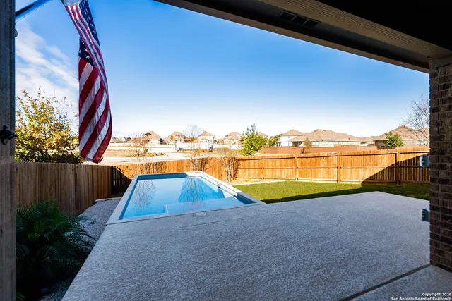 a view of swimming pool with outdoor space and seating area