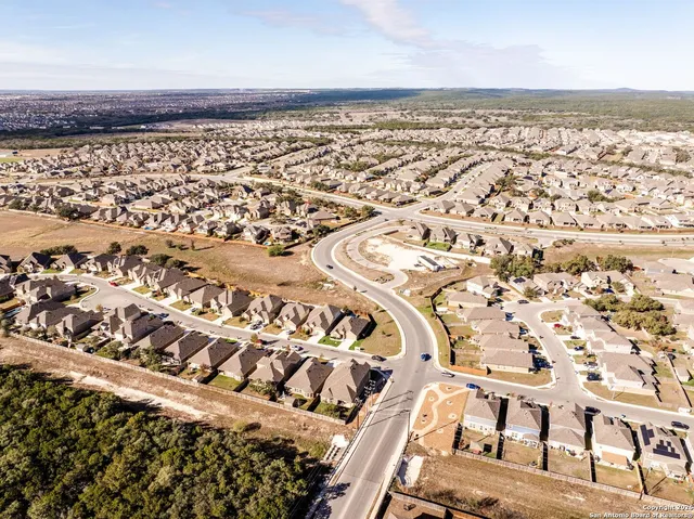wooden floor with view of a swimming pool