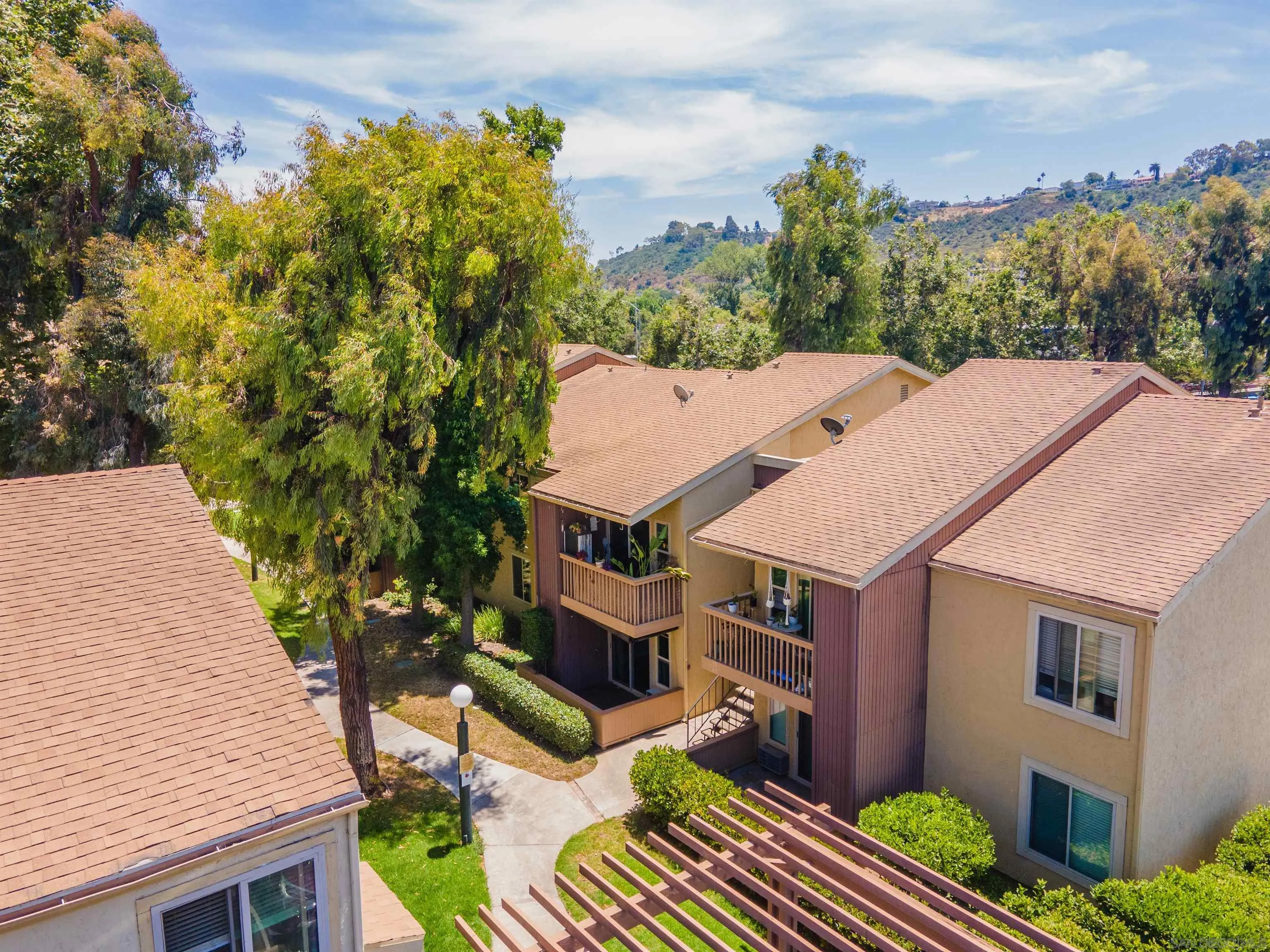 5922 Rancho Mission Road, Unit 67 San Diego, CA 92108 - Photo 18 of 19 an aerial view of a house with a yard