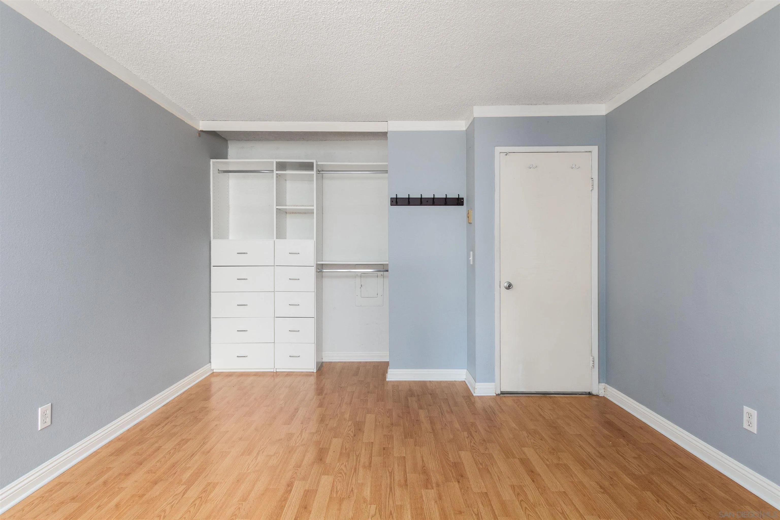 5922 Rancho Mission Road, Unit 67 San Diego, CA 92108 - Photo 7 of 19 a view of empty room with wooden floor