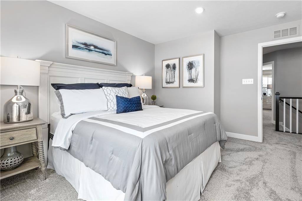 130 Olivia Drive Eighty Four, PA 15330 - Photo 22 of 27 a bedroom with a bed and a painting on the wall