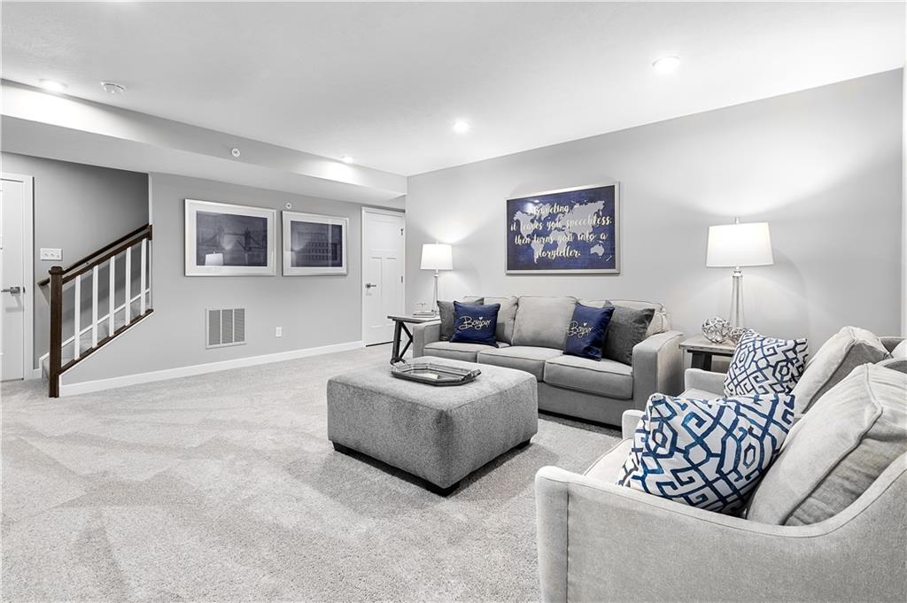 130 Olivia Drive Eighty Four, PA 15330 - Photo 27 of 27 a living room with furniture and a night stand