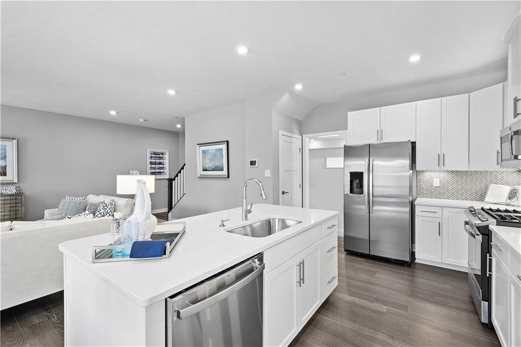 130 Olivia Drive Eighty Four, PA 15330 - Photo 8 of 27 a kitchen with refrigerator and white cabinets