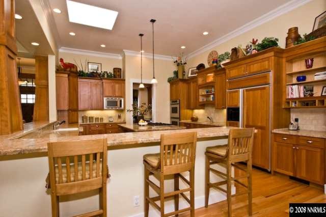 4055 Water Hole Circle Reno, NV 89519 - Photo 5 of 9 a kitchen with stainless steel appliances kitchen island granite countertop a sink and cabinets