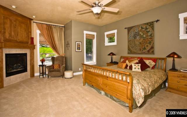 4055 Water Hole Circle Reno, NV 89519 - Photo 7 of 9 a bed room with a bed and a chair