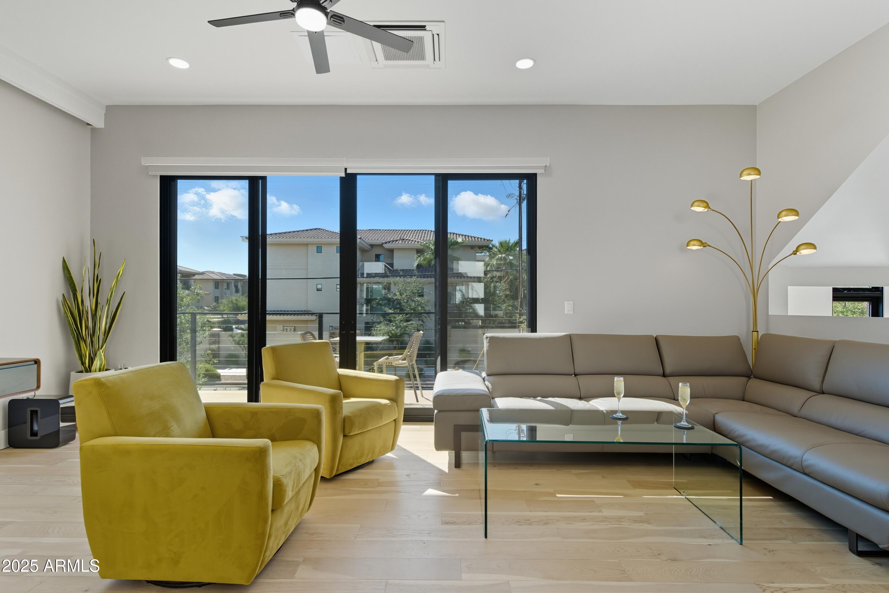 1501 North Miller Road, Unit 1015 Scottsdale, AZ 85257 - Photo 14 of 50 a living room with furniture and a large window
