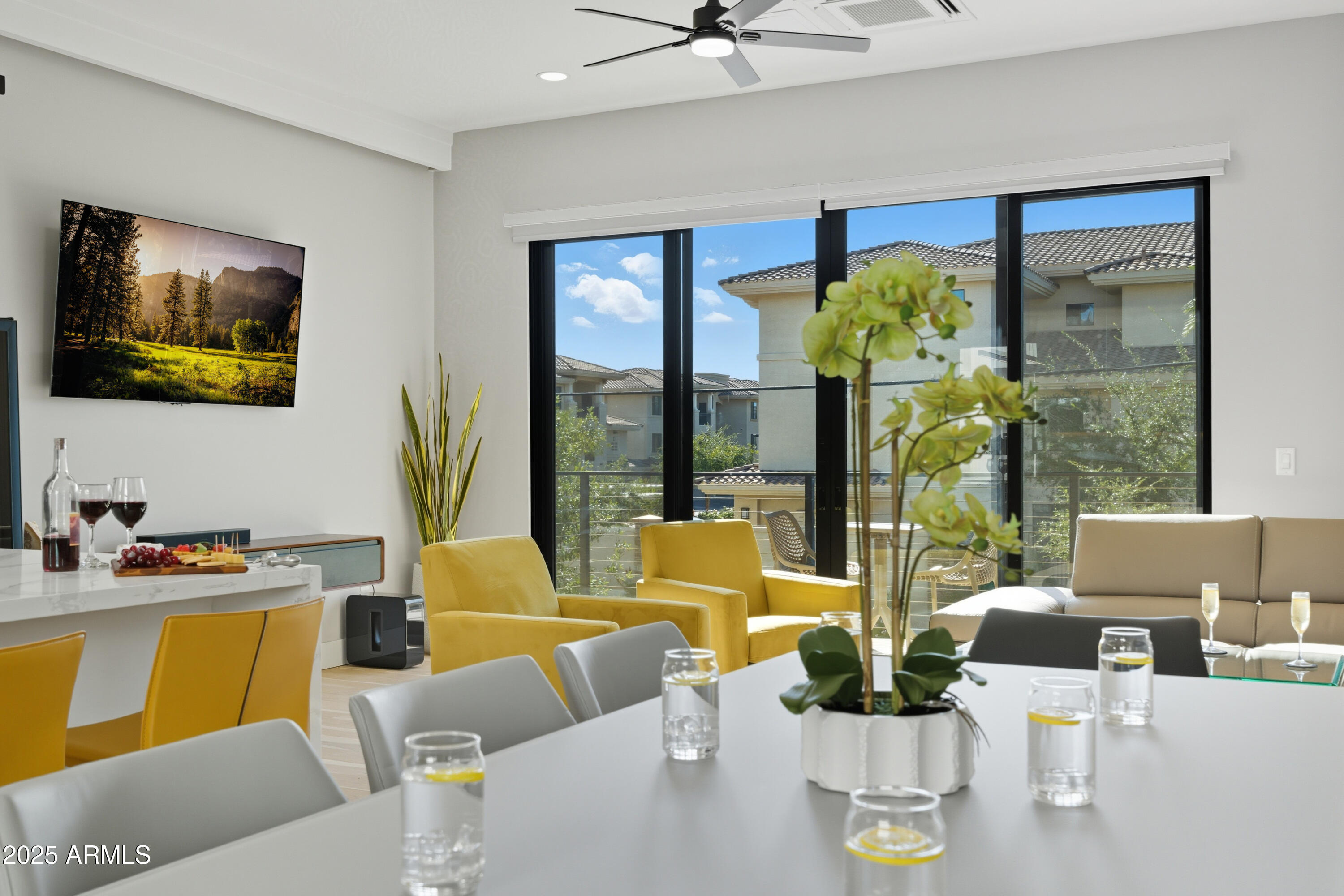1501 North Miller Road, Unit 1015 Scottsdale, AZ 85257 - Photo 3 of 50 a living room with furniture and a flat screen tv