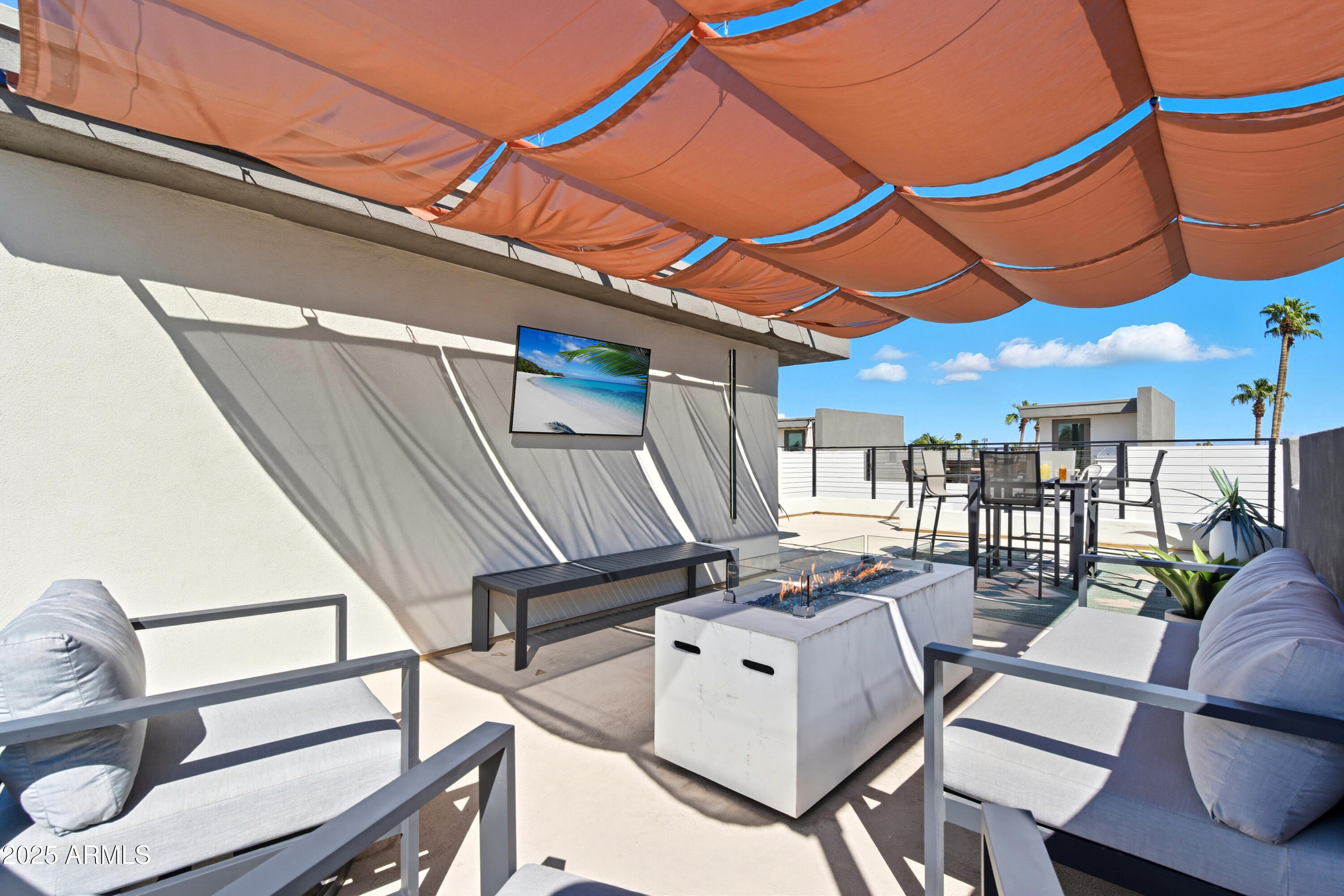 1501 North Miller Road, Unit 1015 Scottsdale, AZ 85257 - Photo 47 of 50 a view of a chairs and table in the balcony