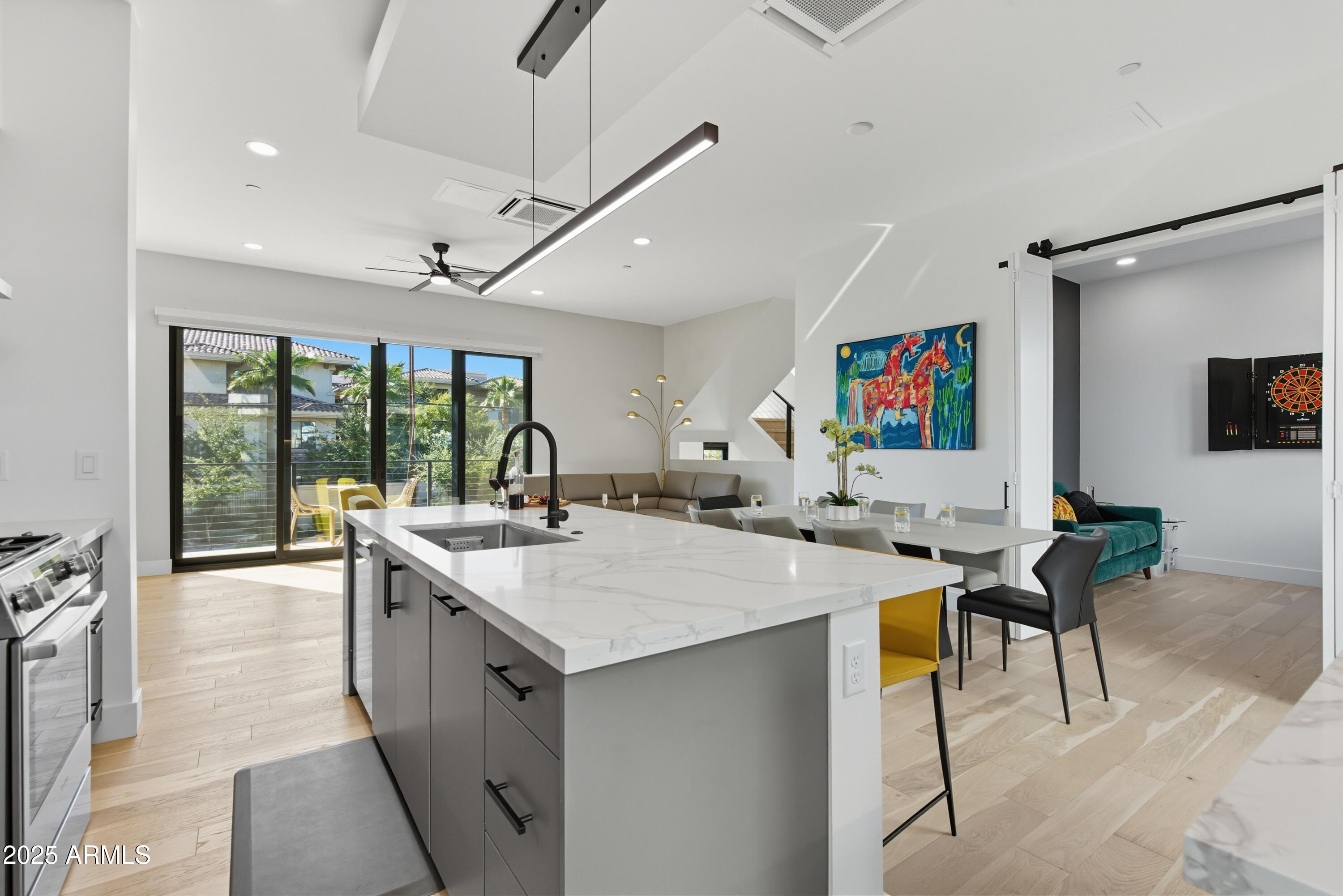 1501 North Miller Road, Unit 1015 Scottsdale, AZ 85257 - Photo 6 of 50 a large white kitchen with a large window