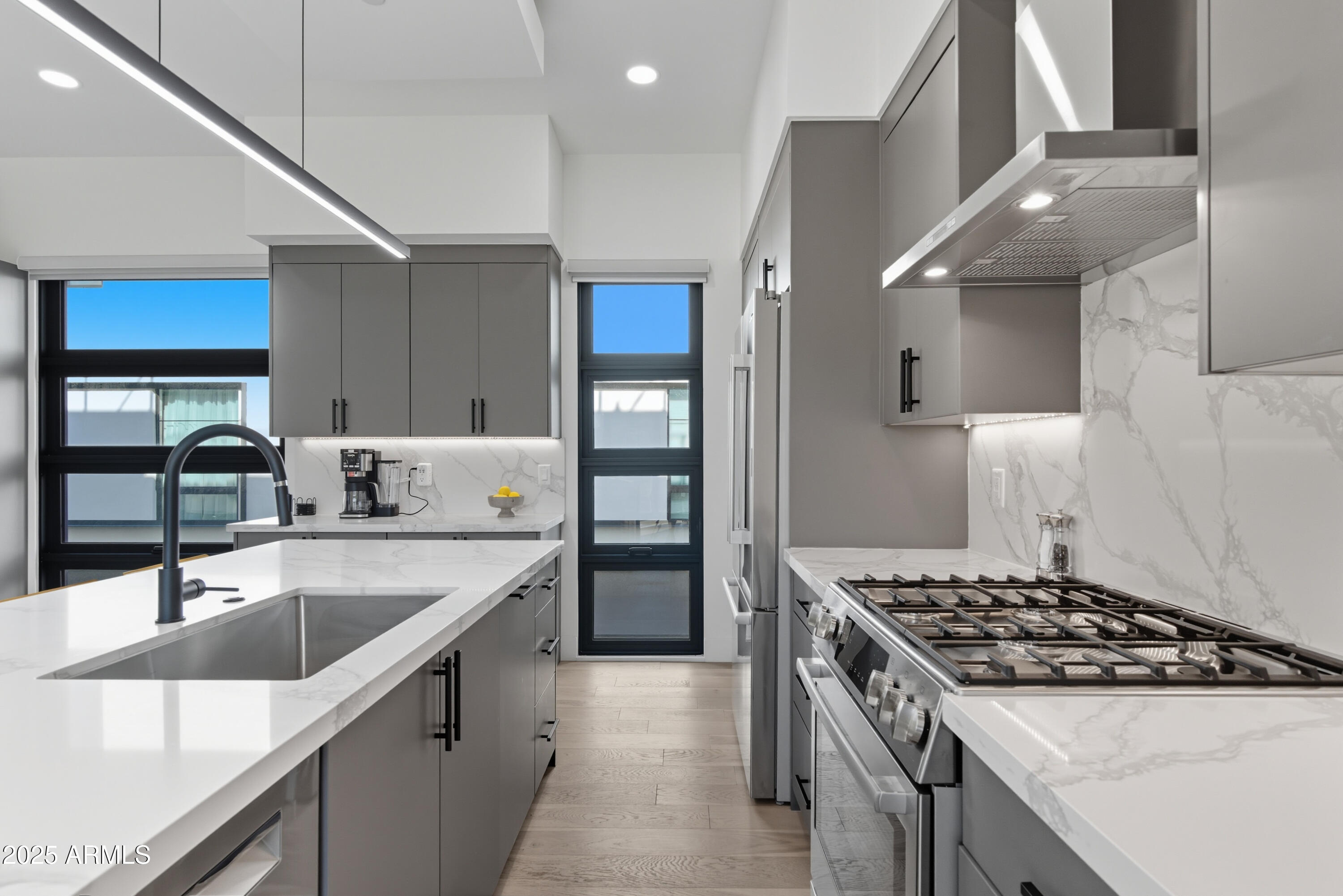 1501 North Miller Road, Unit 1015 Scottsdale, AZ 85257 - Photo 8 of 50 a kitchen with stainless steel appliances granite countertop a sink stove and refrigerator