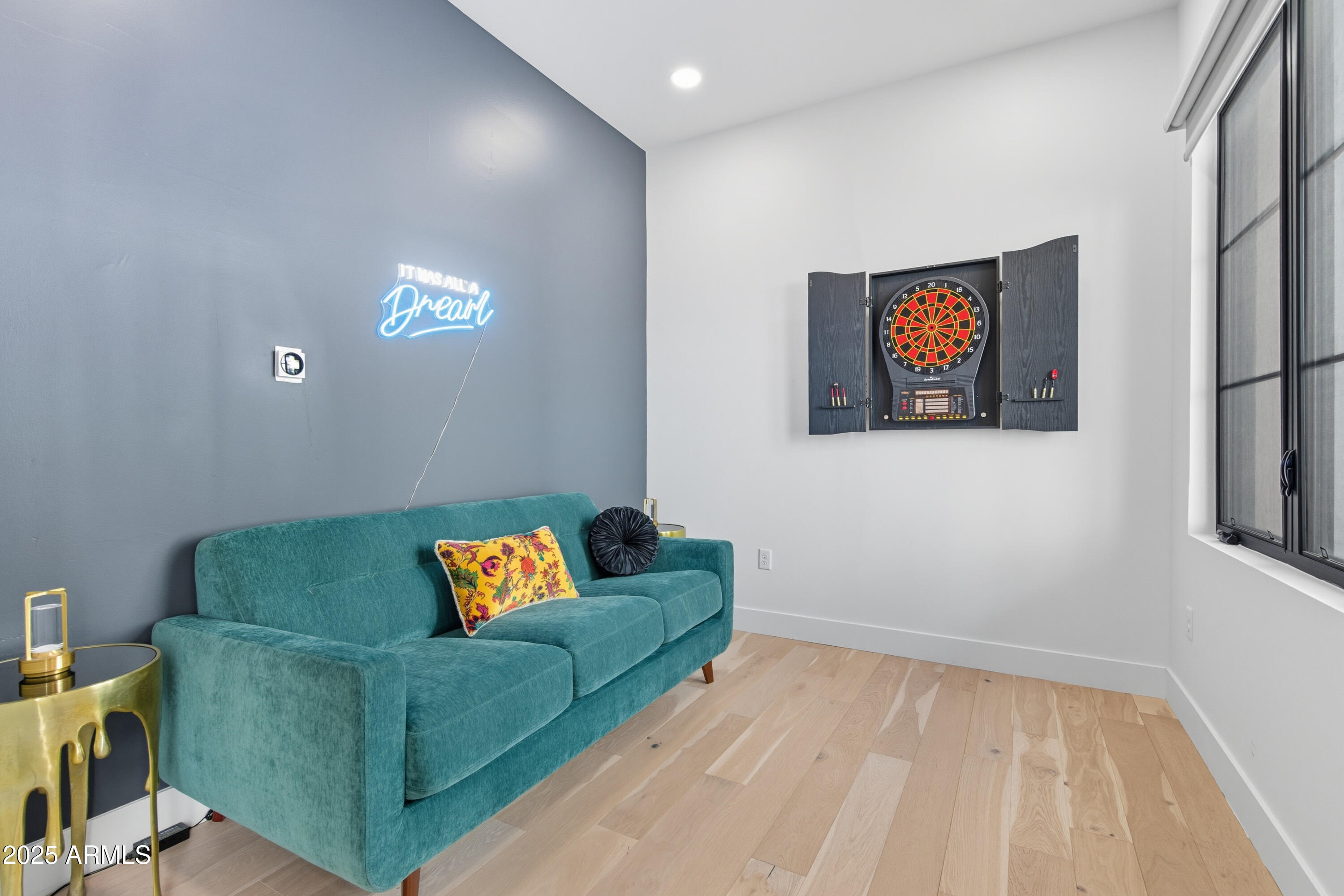 1501 North Miller Road, Unit 1015 Scottsdale, AZ 85257 - Photo 9 of 50 a living room with furniture and a wooden floor
