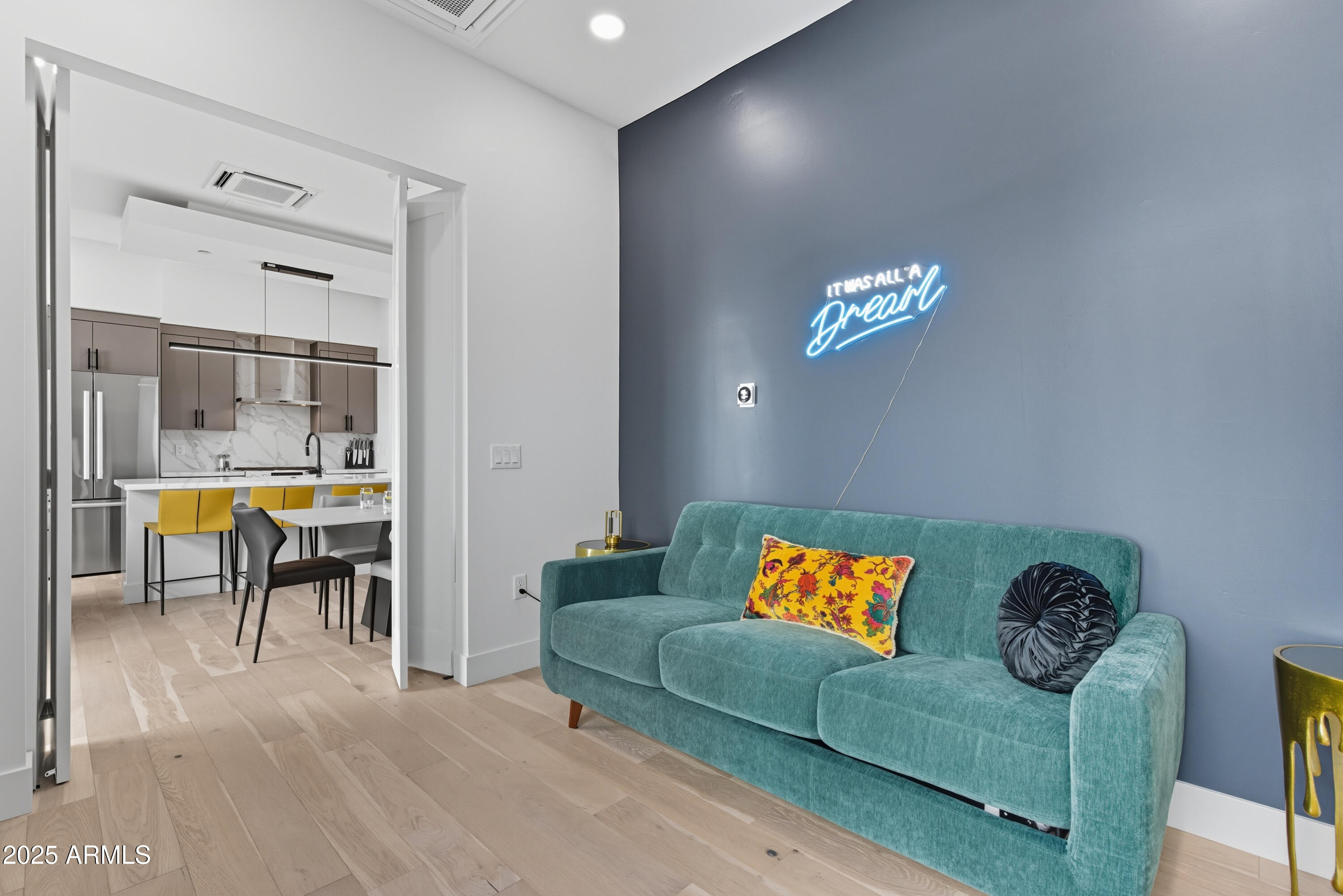 1501 North Miller Road, Unit 1015 Scottsdale, AZ 85257 - Photo 10 of 50 a living room with furniture and a dining table