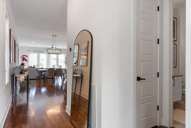 a view of living room and dining room with wooden floor