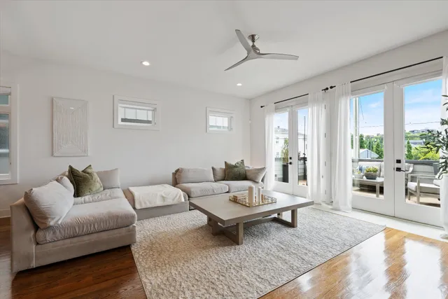 a living room with furniture and a rug