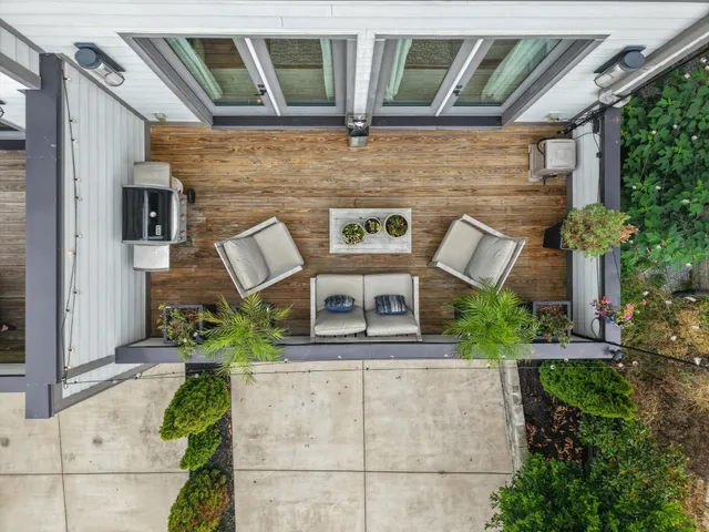 a spacious bedroom with a bed and wooden floor