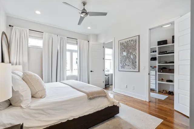 a bathroom with a white bath tub a shower and a sink