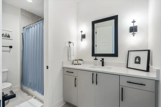 a bedroom with a bed and a walk in closet