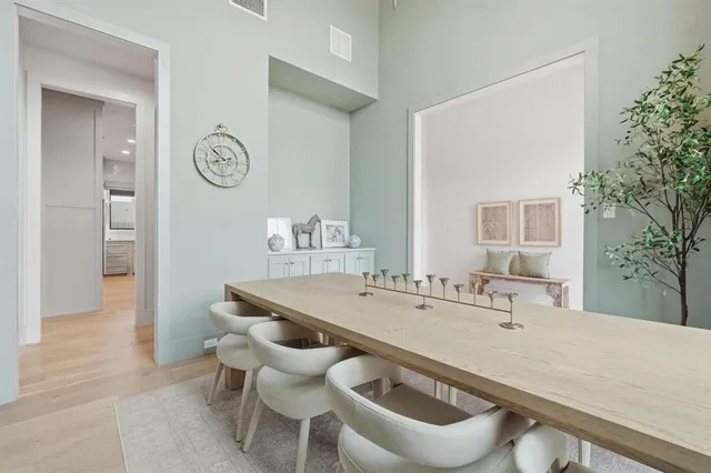 a dining room with a table and chairs