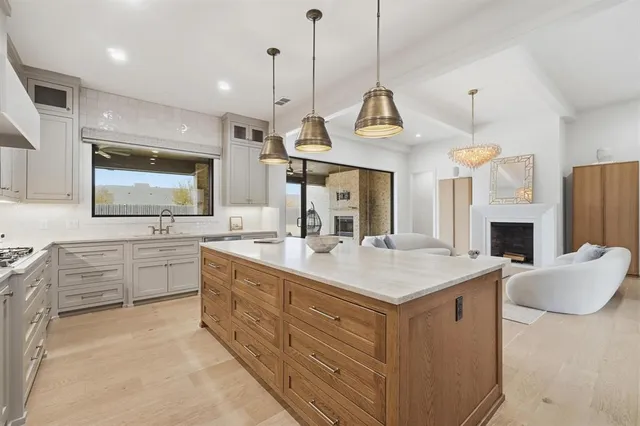 a view of living room with granite countertop furniture and fireplace