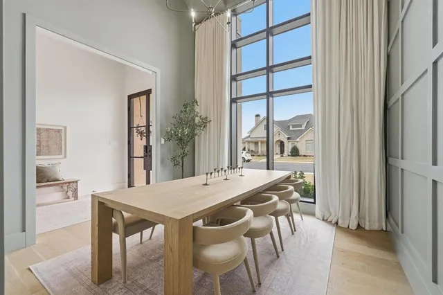 a view of a dining room with furniture and window