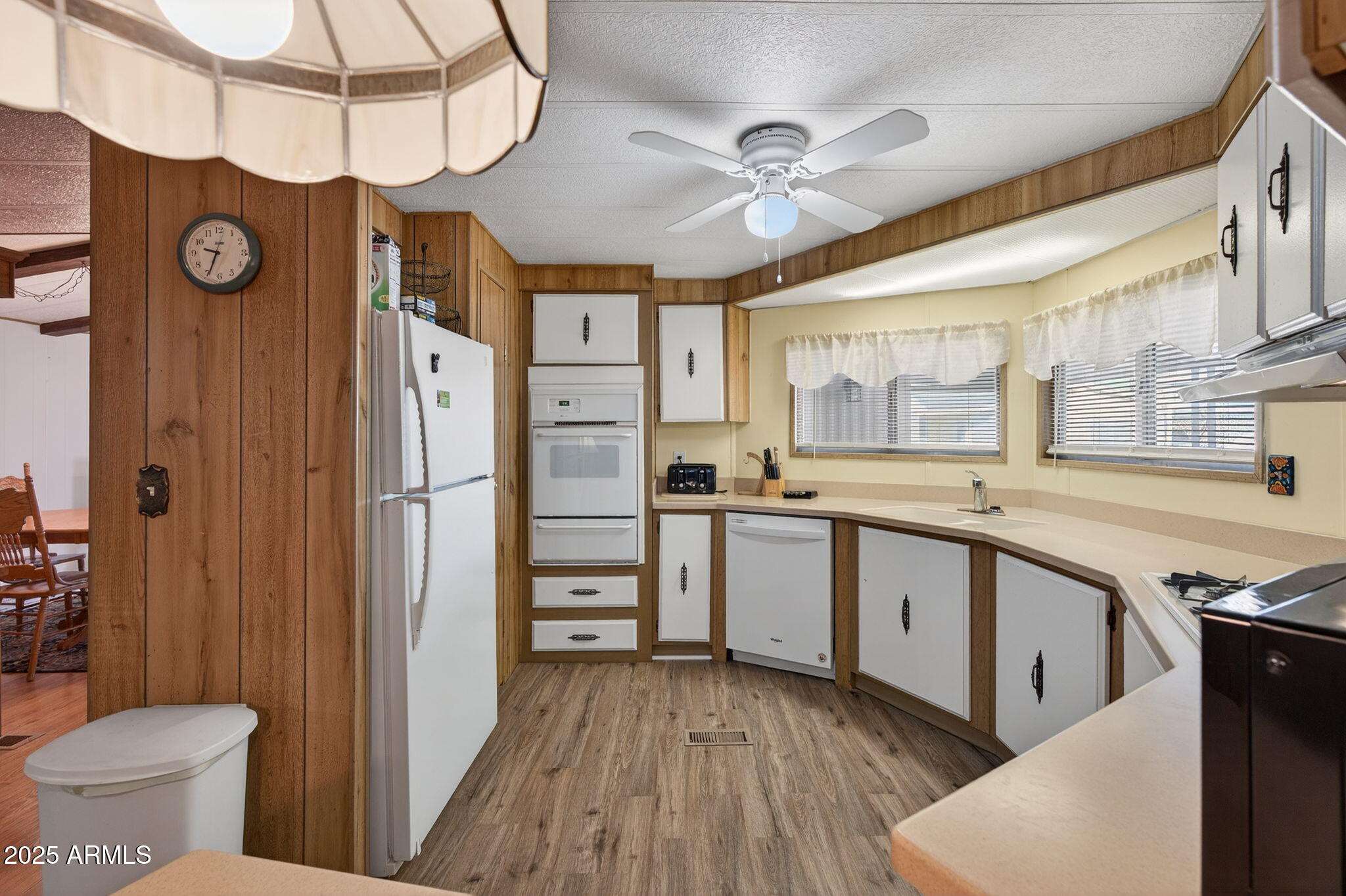2100 North Trekell Road, Unit 131 Casa Grande, AZ 85122 - Photo 11 of 46 a kitchen with a refrigerator and a sink