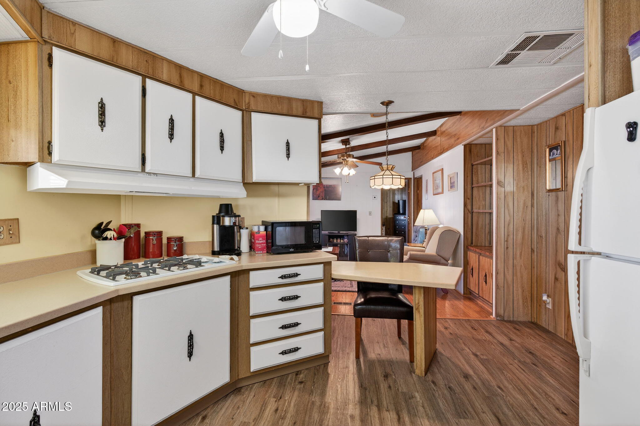 2100 North Trekell Road, Unit 131 Casa Grande, AZ 85122 - Photo 12 of 46 a kitchen with stainless steel appliances sink refrigerator microwave and cabinets