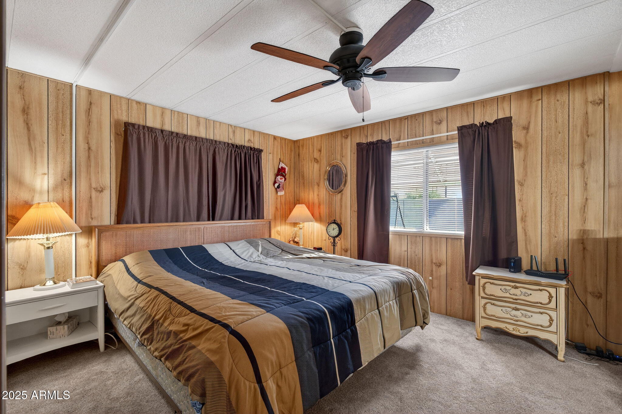 2100 North Trekell Road, Unit 131 Casa Grande, AZ 85122 - Photo 16 of 46 a bedroom with a bed and a chandelier