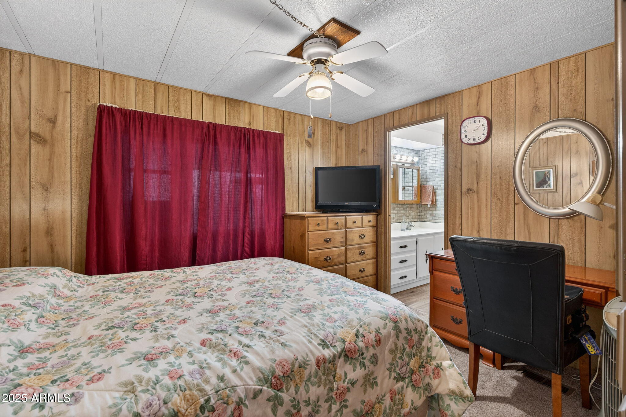 2100 North Trekell Road, Unit 131 Casa Grande, AZ 85122 - Photo 24 of 46 a bedroom with a bed and a television