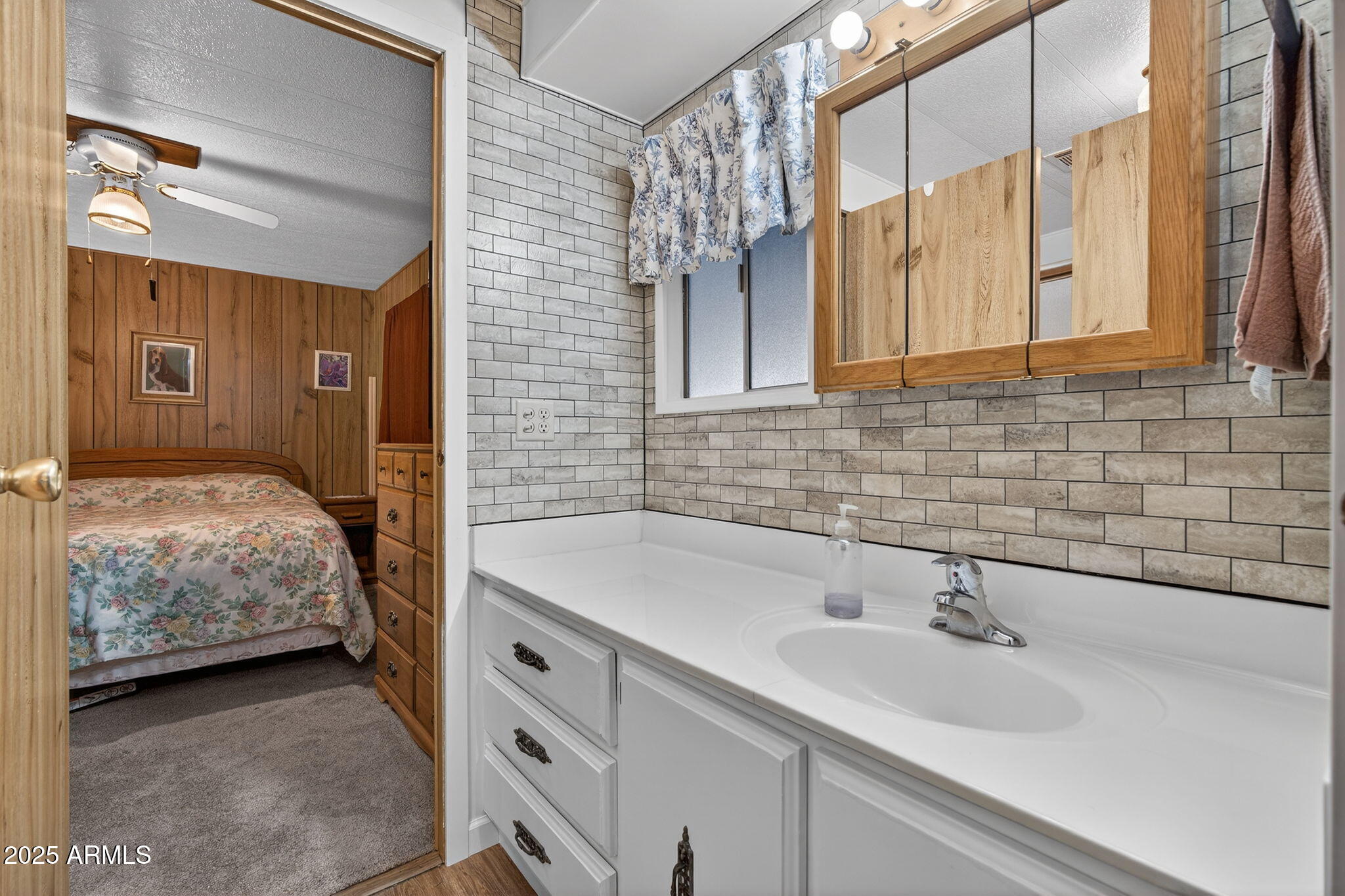 2100 North Trekell Road, Unit 131 Casa Grande, AZ 85122 - Photo 25 of 46 a bedroom with a sink and a mirror